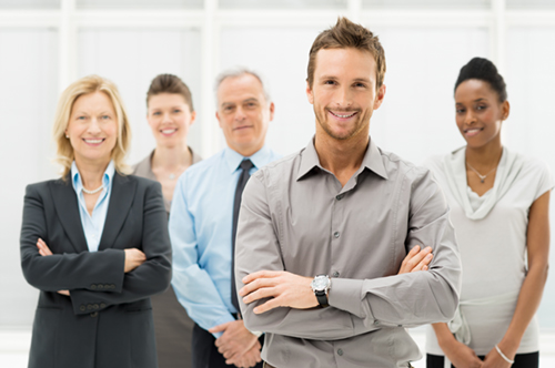 Portrait Of Happy Businesspeople Portrait Of Young Businessman With Business Team